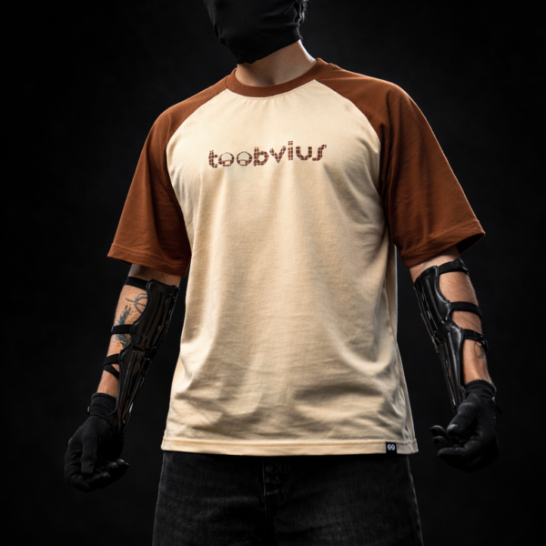 Noise Meets Structured Equalizer reglan oversized t-shirt front view with beat-inspired equalizer grid logo in brown on beige body