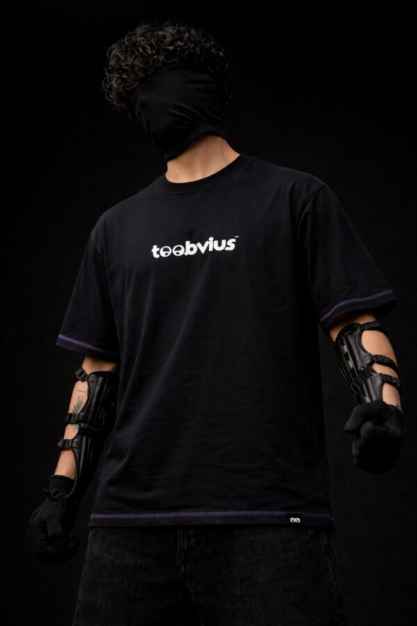 Black oversized t-shirt with Toobvius logo print on front, purple stitch detailing, streetwear fashion India